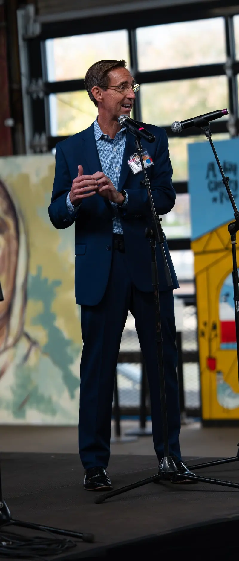 A speaker presenting on stage